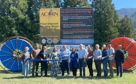 Leaders of CDT, Hoopa Valley Tribal Council, Hoopa Valley Public Utilities District, and CA Public Utilities Commission gather for a ribbon cutting.
